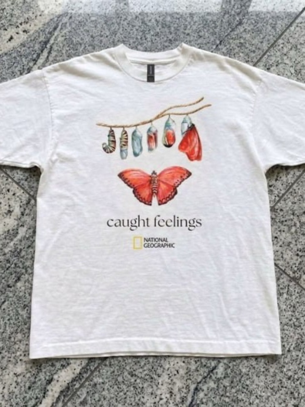 White National Geographic Caught feeling butterfly T shirt